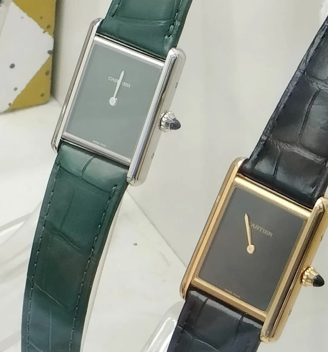 Cartier Tank — rectangular case with burgundy strap